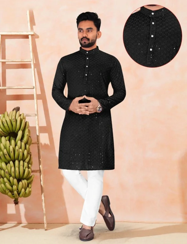 Elegant black chikankari kurta for men paired with white pajama, styled with brown loafers for a modern ethnic look.